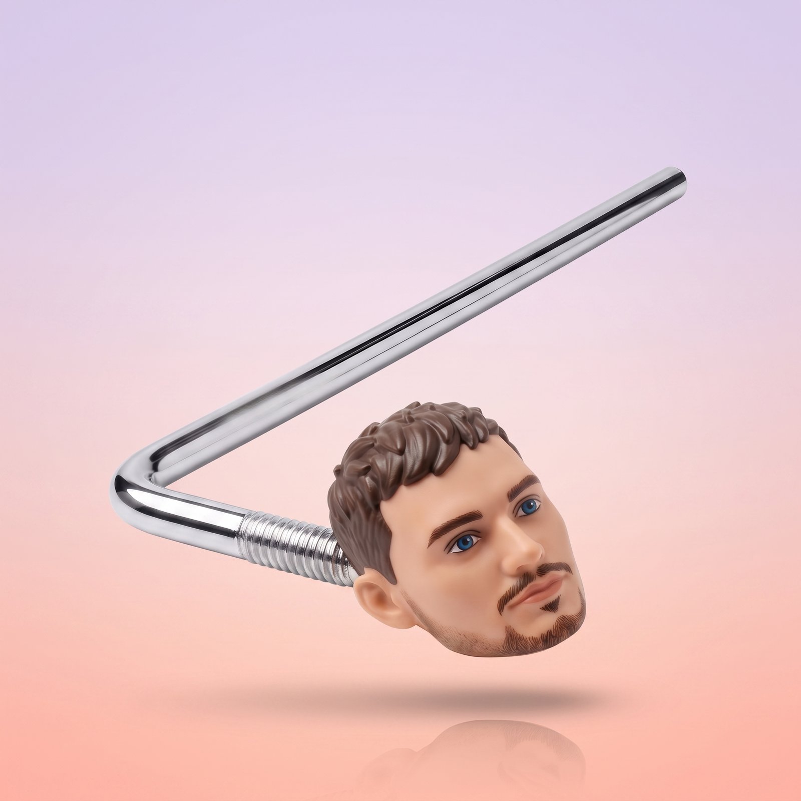 CO·PILOT chrome rod and doll head ornament, studio shot on soft gradient background